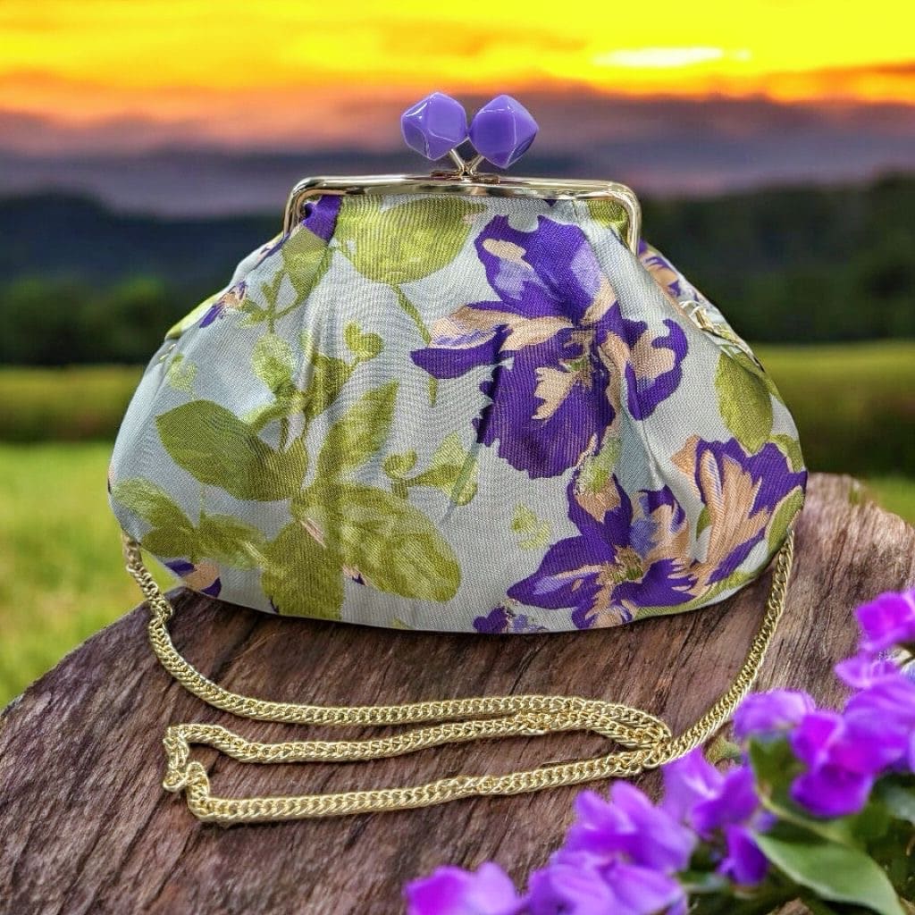 Borsa clutch in jacquard con fiori viola e verdi