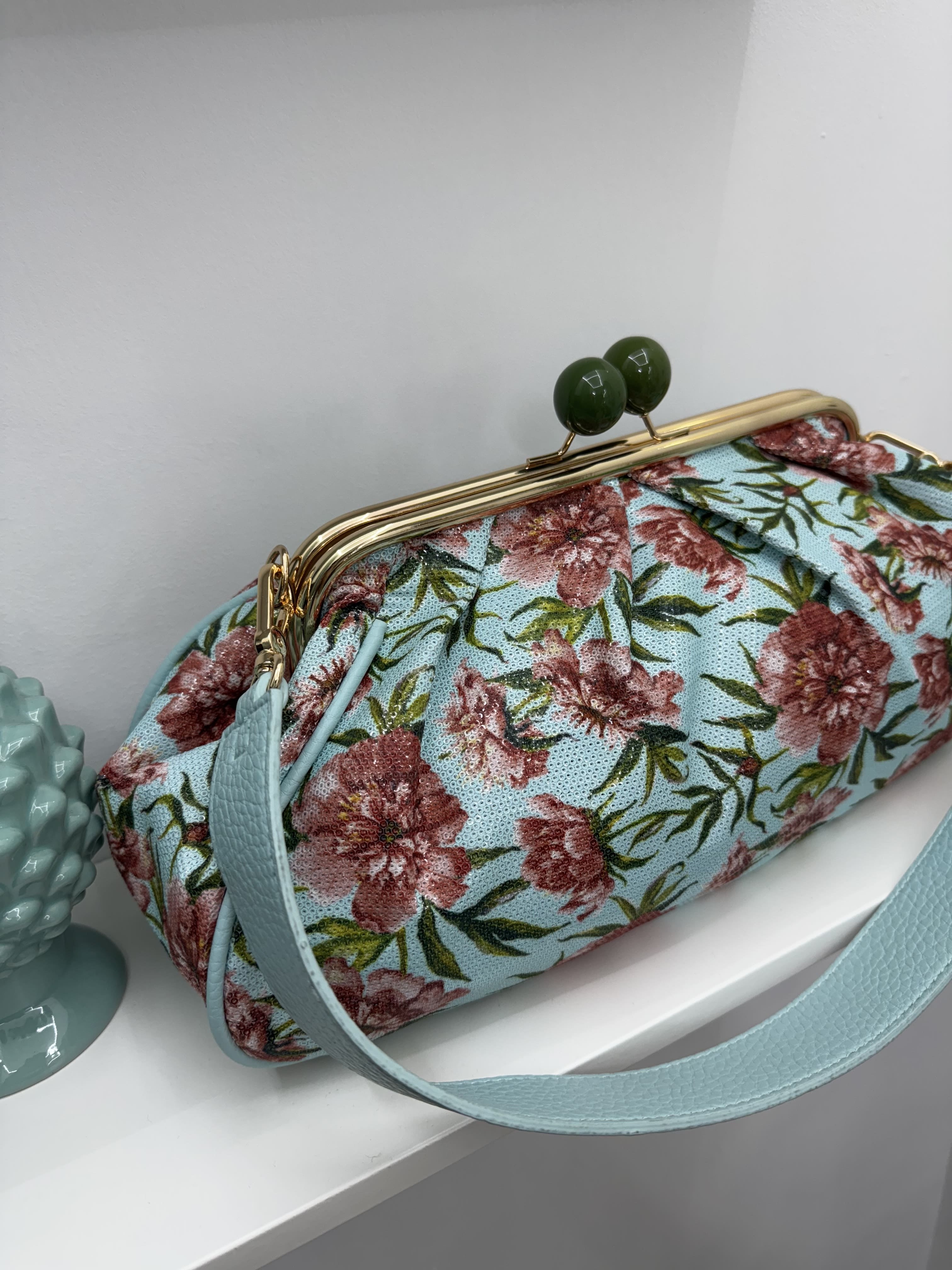 Borsa clutch con paillettes e motivo a fiori