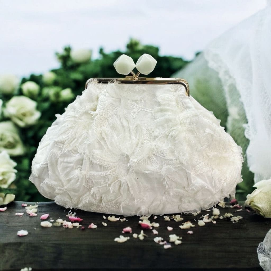 Borsa clutch in jacquard e organza con fiori