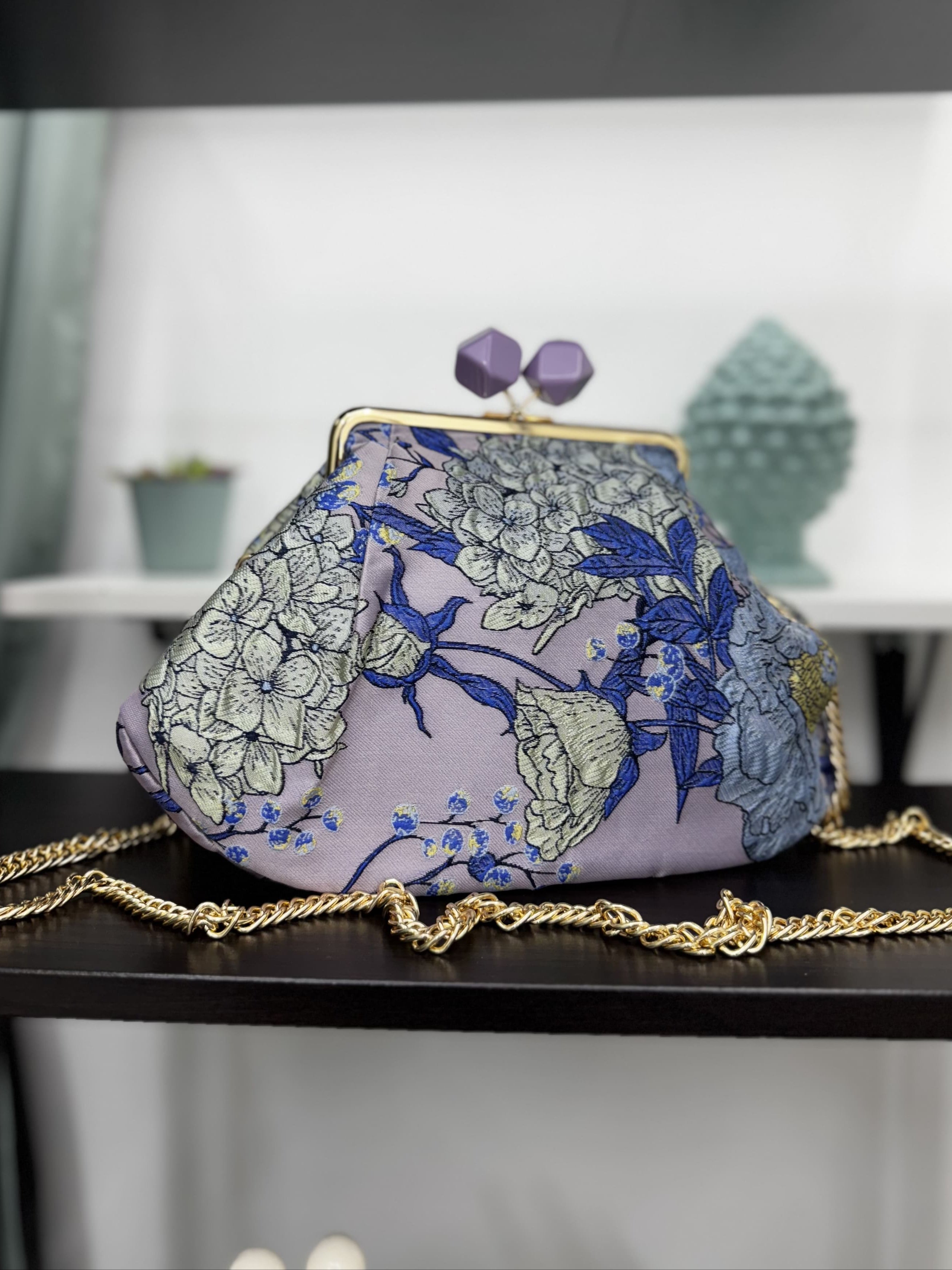 Borsa clutch in tessuto jacquard con fiori