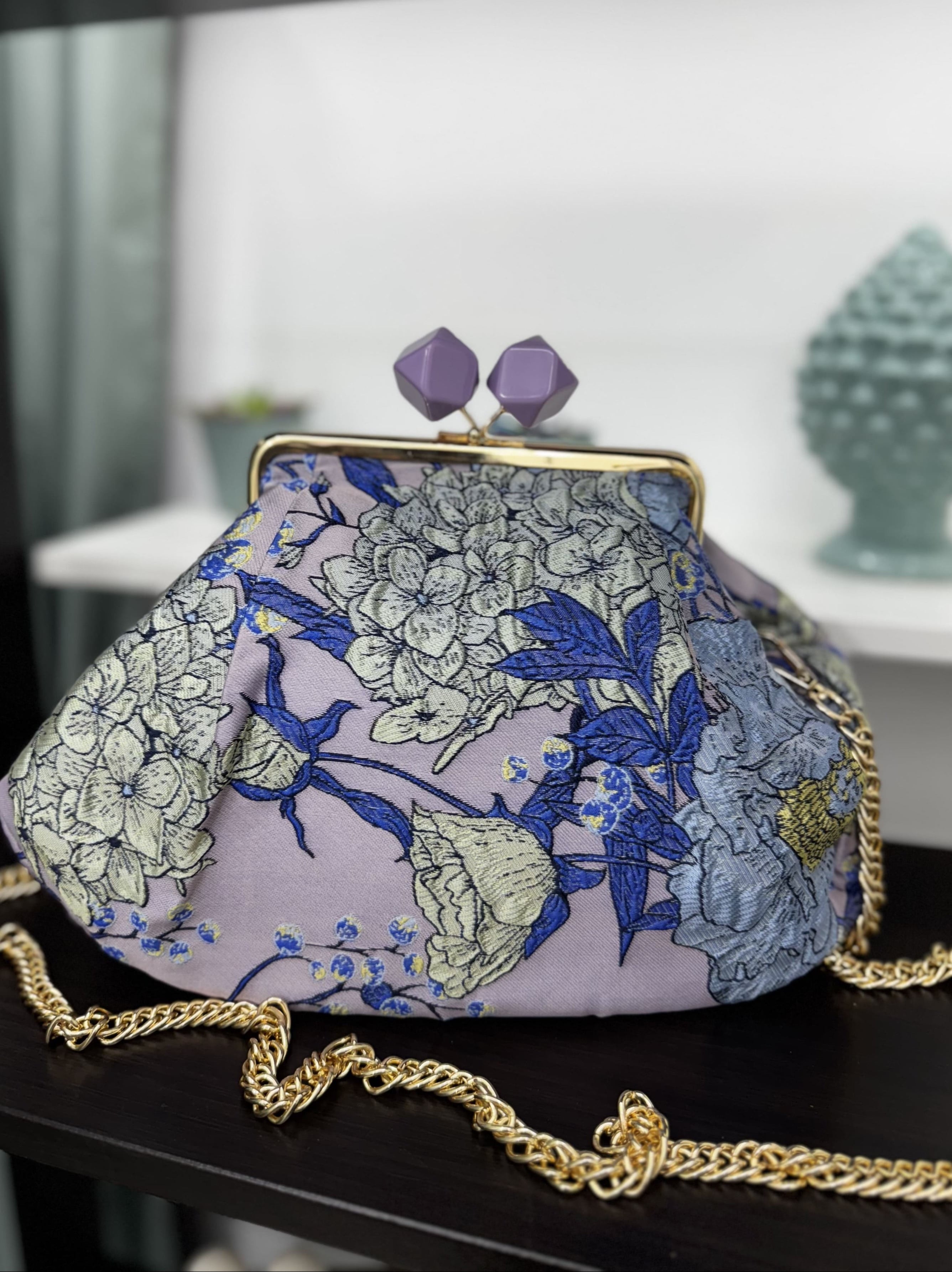 Borsa clutch in tessuto jacquard con fiori