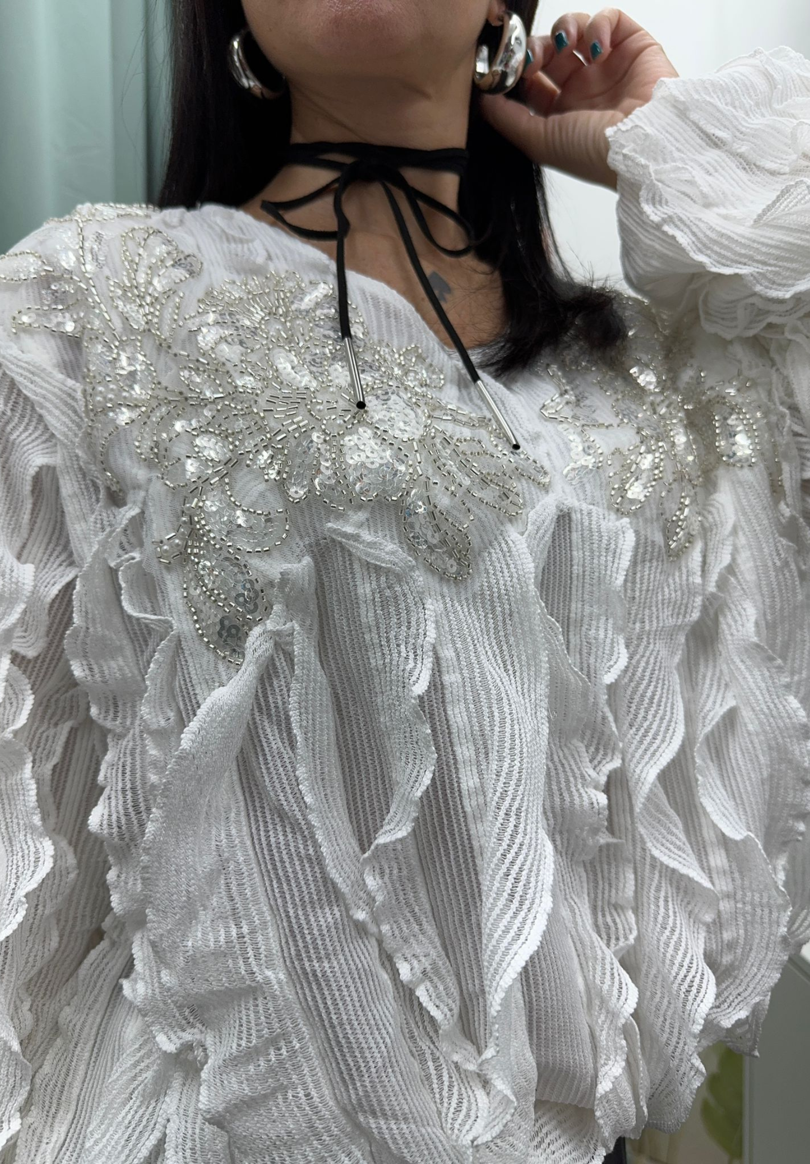 Maglia con volant e paillettes