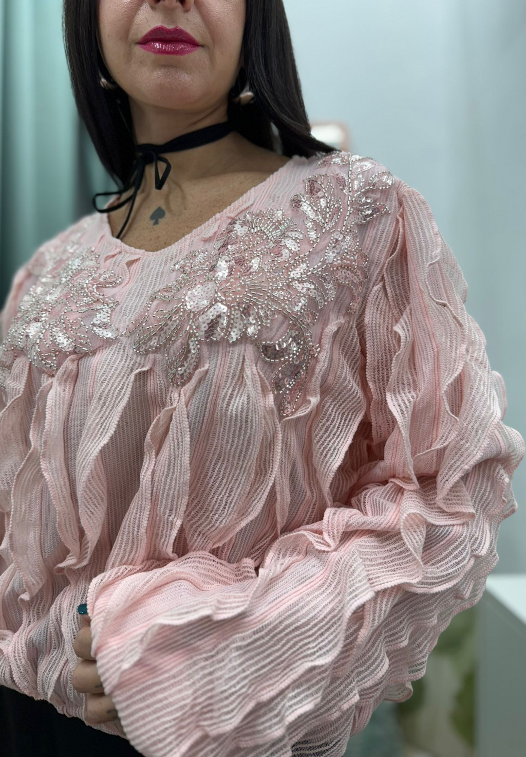 Maglia con volant e paillettes