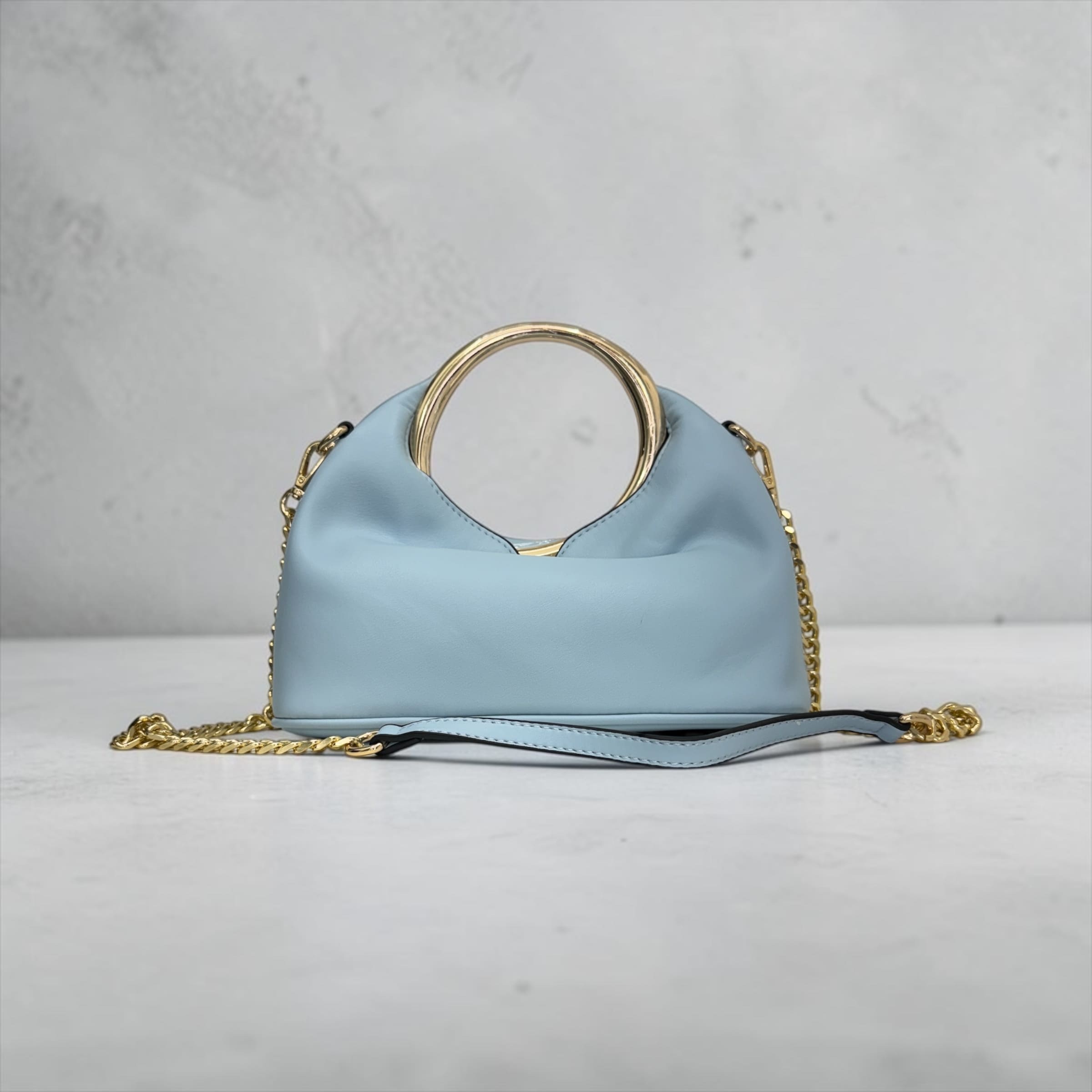 Borsa a Mano "Glam Ring" con Tracolla a Catena – Eleganza Contemporanea
