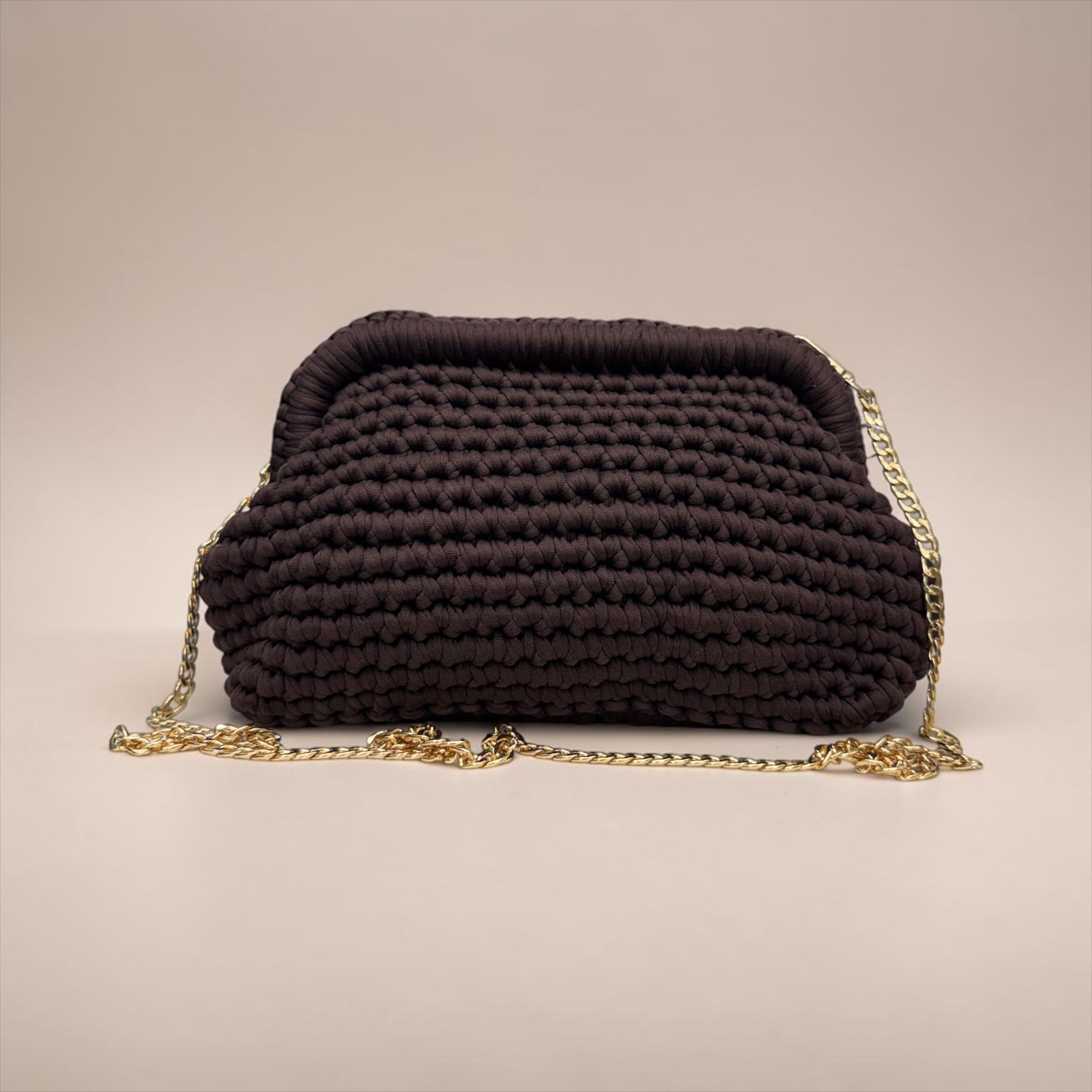 Borsa clutch in fettuccia ad uncinetto