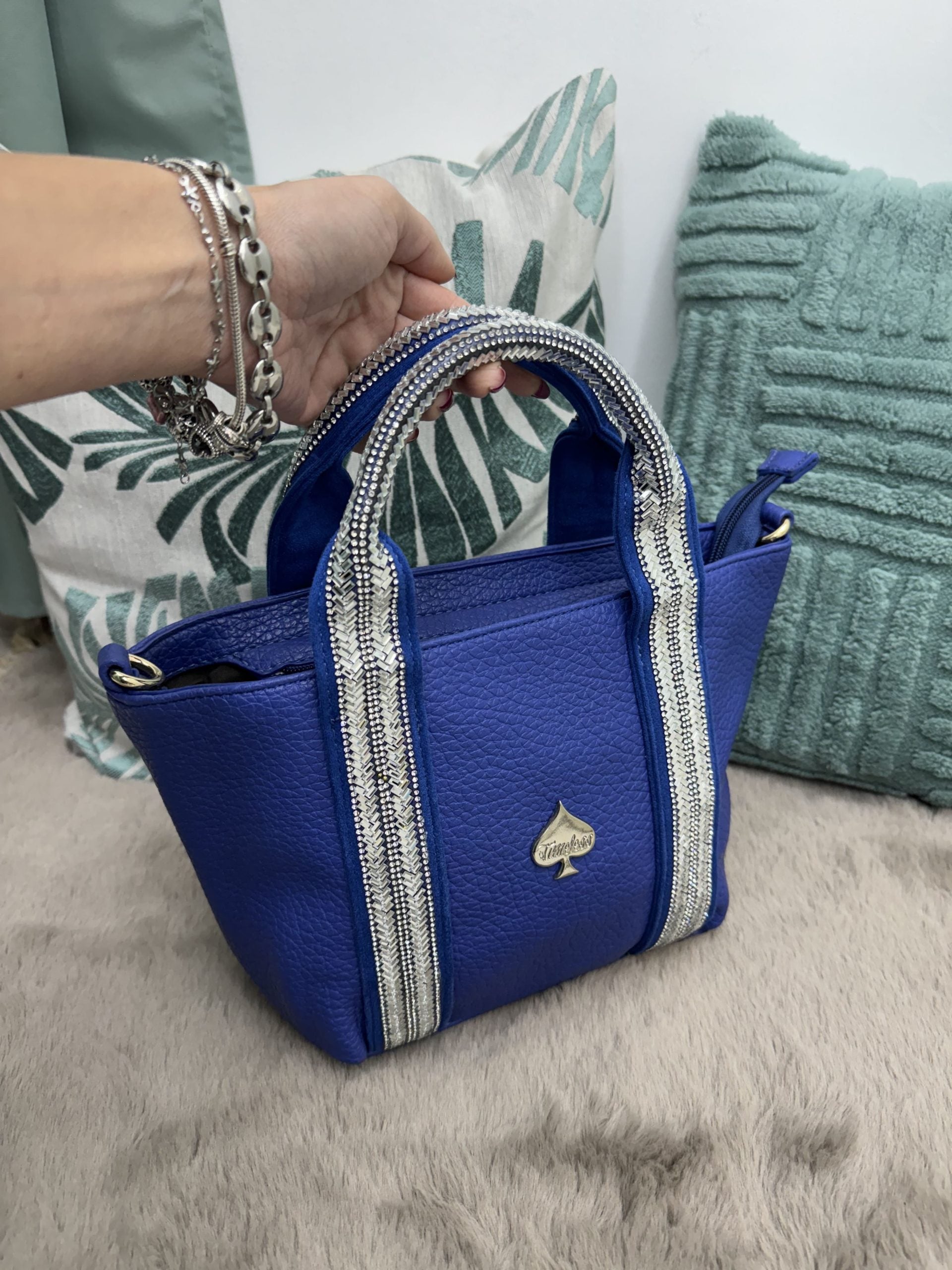 Borsa a mano con dettagli e manici in strass