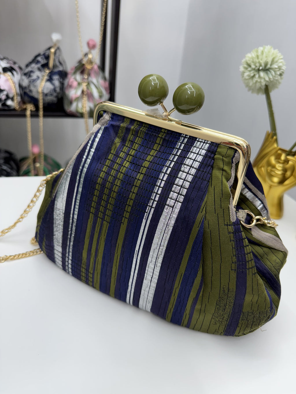 Borsa clutch in tessuto jacquard in fantasia astratta