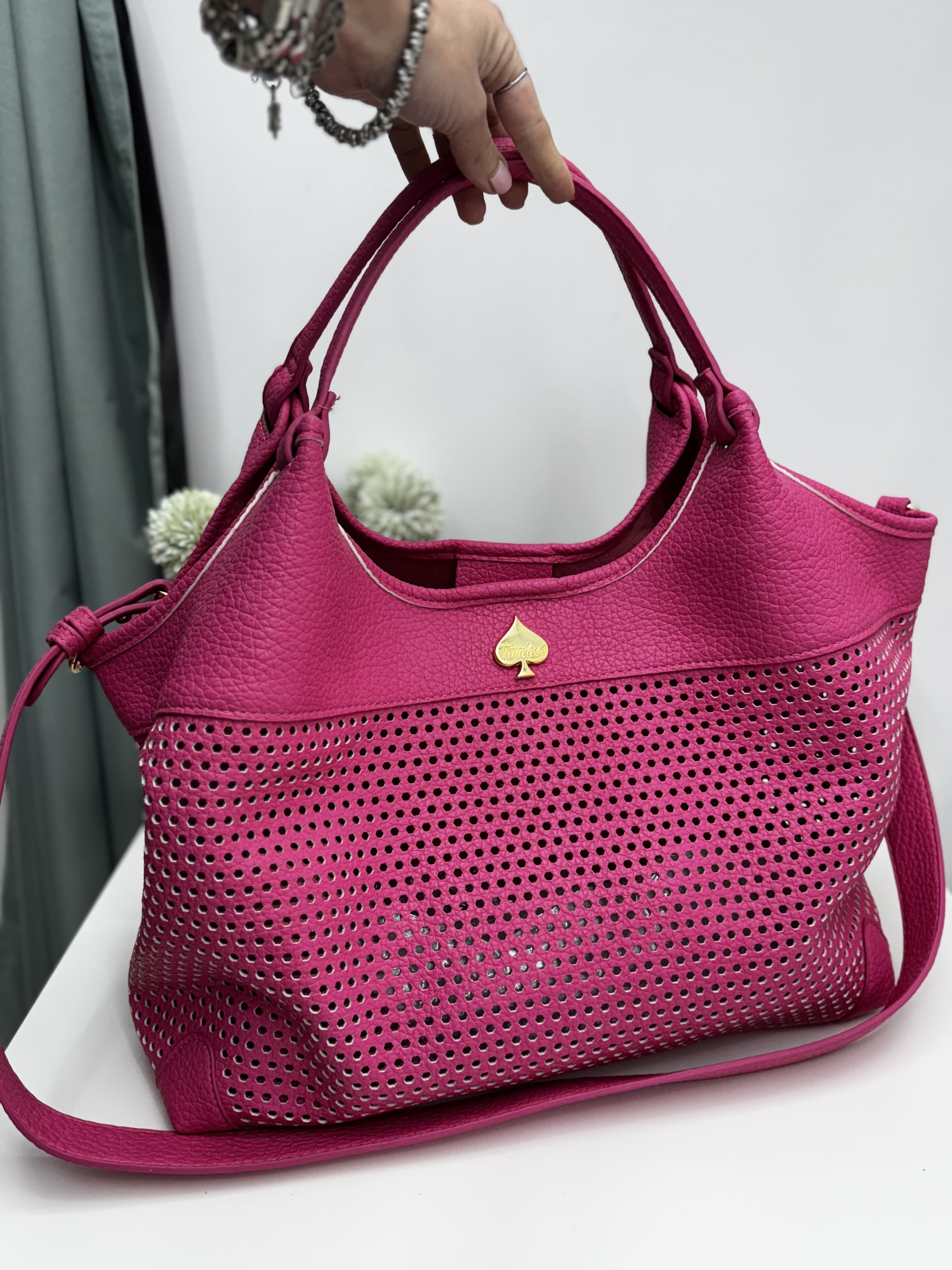 Borsa a mano traforata